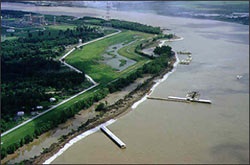 Aerial photo of the Mississippi River with a levee in the background.